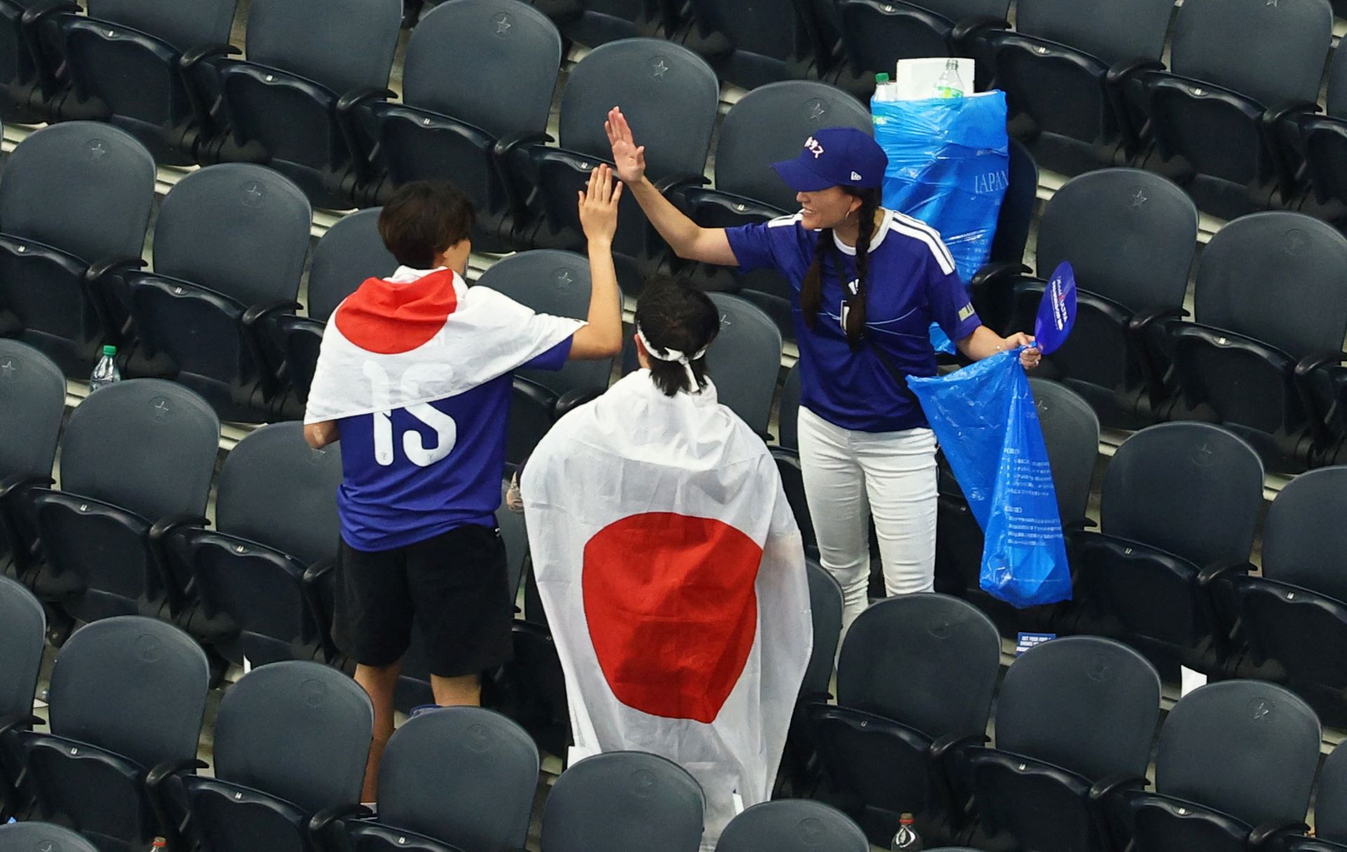 Japan fans uphold tradition as they clean up stadium after Netherlands match