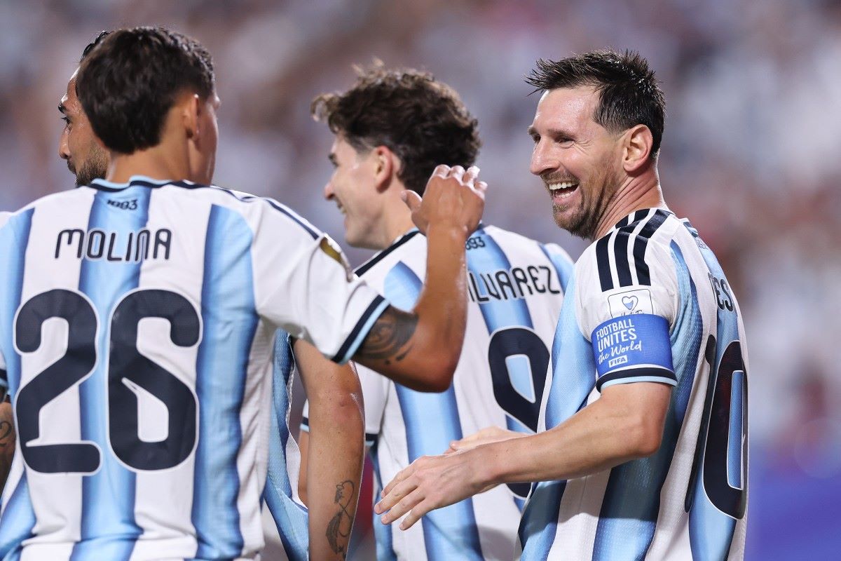 Magical Messi shines as Argentina begin title defence with 3-0 win over Algeria