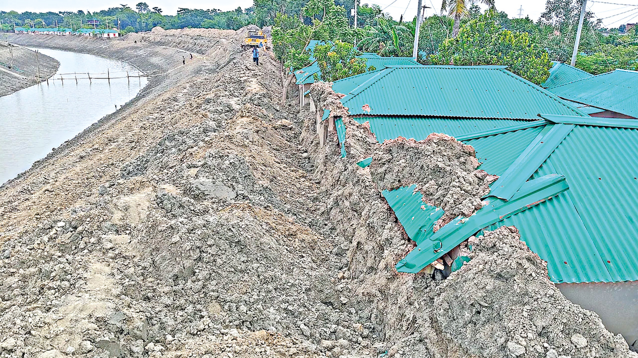 Massive mounds of excavated riverbed clay piled against homes, turning a government-built sanctuary into a structural hazard. Photos: Md. Al-Mamun