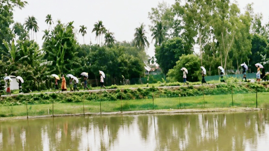 Kurigram farmers take urea fertiliser from dealer warehouse