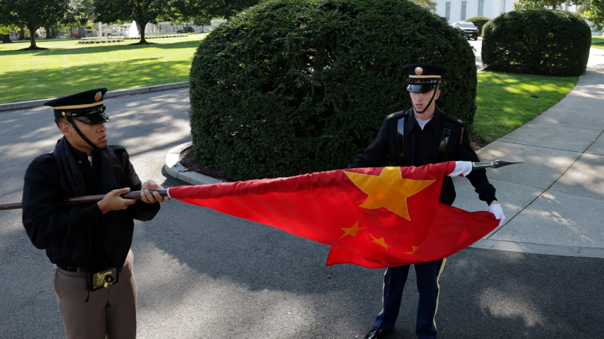 Members of a U.S. military honor guard roll up a Chinese flag after rehearsing for Chinese President Xi Jinping’s state visit next week with U.S. President Donald Trump at the White House in Washington, D.C., U.S., September 16, 2026.