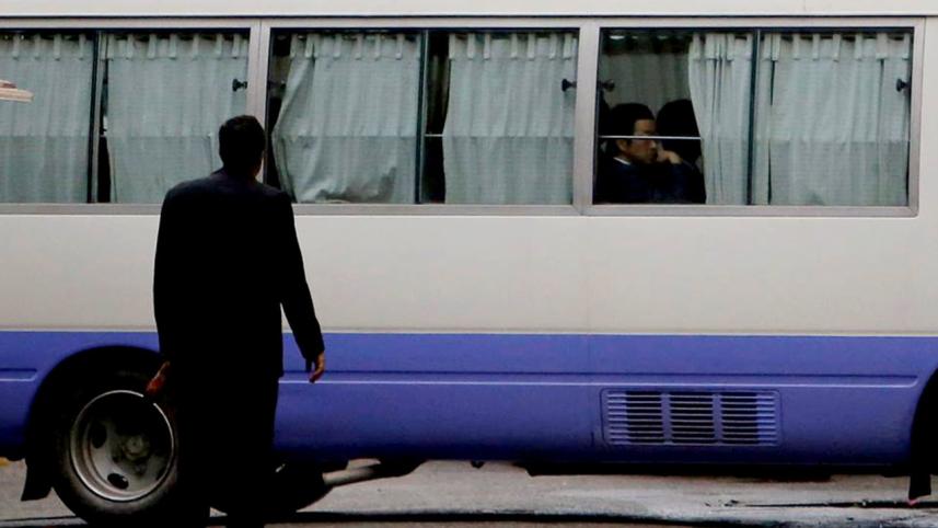 A minibus part of a Japanese convoy, as relatives of victims of an attack on the Holey Artisan Bakery and the O'Kitchen Restaurant, visited the site, in Dhaka. 