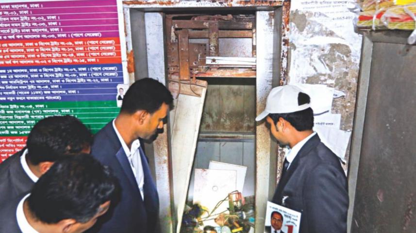 People gather around a collapsed lift