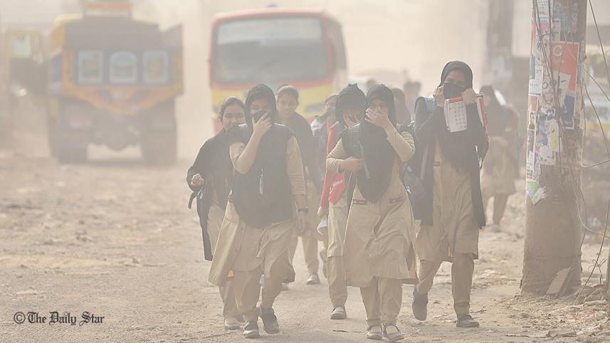 School children cover their faces