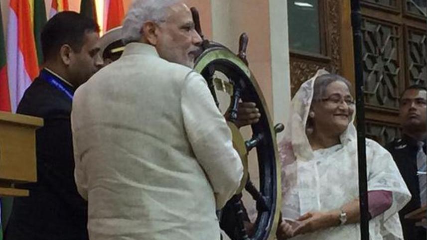 Indian PM Narendra Modi handing over main steering wheel of INS Vikrant to Sheikh Hasina
