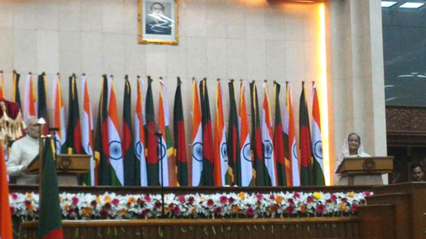 Indian PM Narendra Modi speaking during a joint press briefing at the Bangladesh Prime Minister's Office on the first day of his two-day maiden trip to Bangladesh.