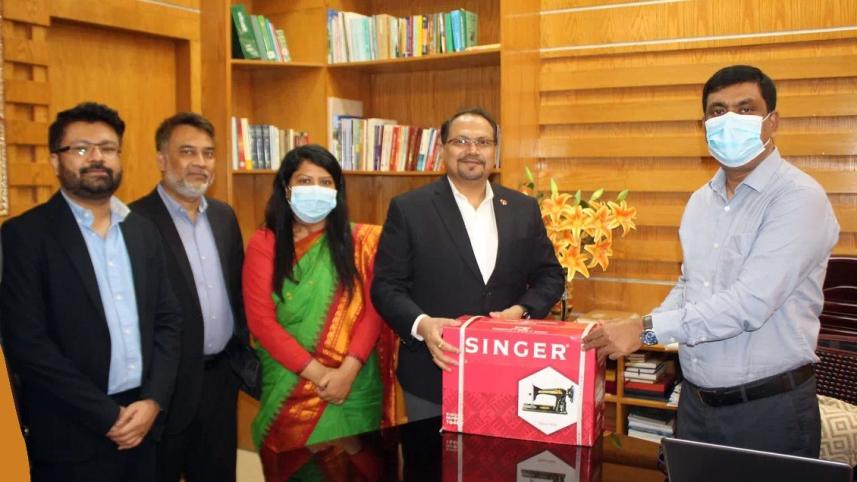 coca-cola_ibpl_distributes_sewing_machine.jpeg