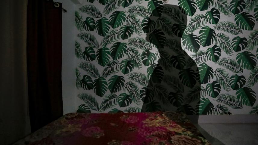 A person's shadow on a wall