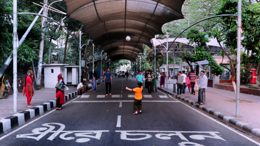 People spending time at a public space in Dhanmondi