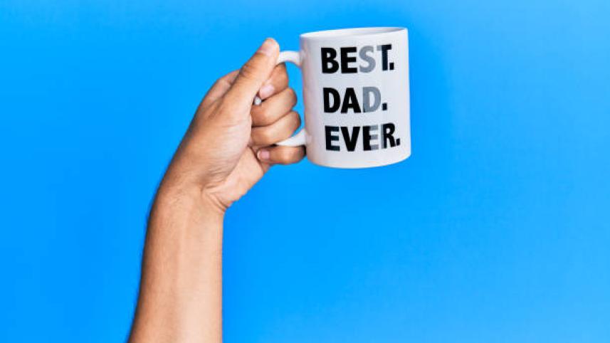 hand-of-hispanic-man-holding-best-dad-ever-coffee-cup-over-isolated-picture-id1281100613.jpg