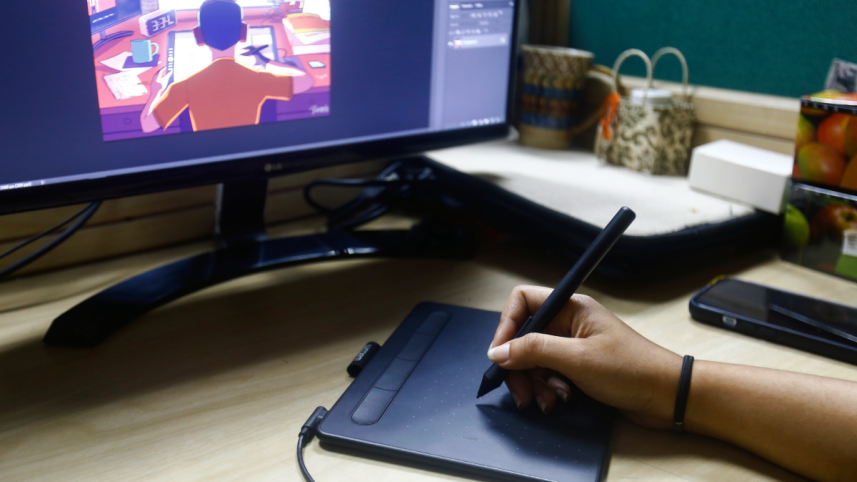 Artist drawing on a graphic tablet