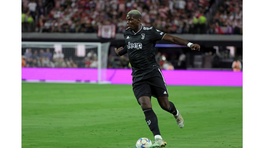 Paul Pogba #10 of Juventus dribbles the ball up the pitch against Chivas during their preseason friendly match at Allegiant Stadium