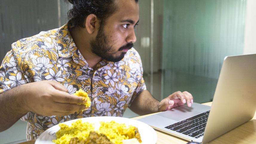 Person working while eating