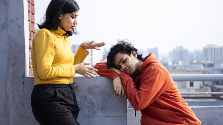 Person trying to talk to a grieving friend
