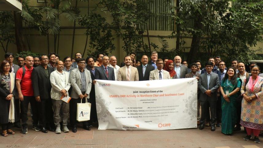 4_-_attendees_pose_together_with_the_event_banner_at_the_premises.jpg