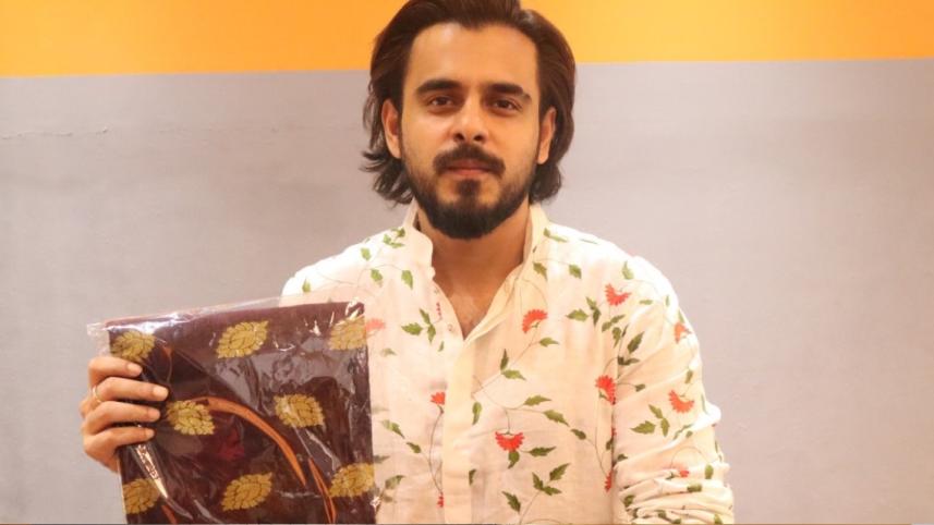 Siam Ahmed buys burnt clothes to aid Bangabazar victims