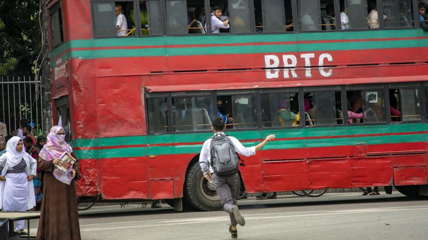 Student running towards a bus.