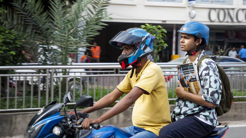 Student commuting on a bike.  
