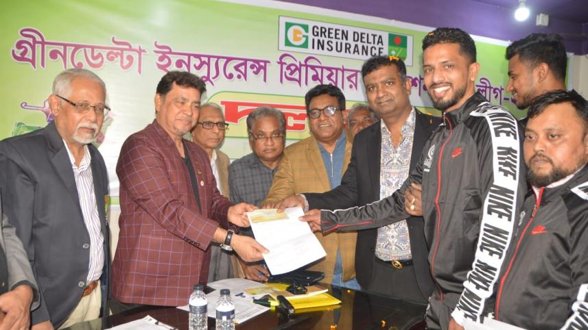 Mohammedan SC player Rasel Mahmud Jimmy hands in the registration form to the Premier Division Hockey League officials. Photo: BHF