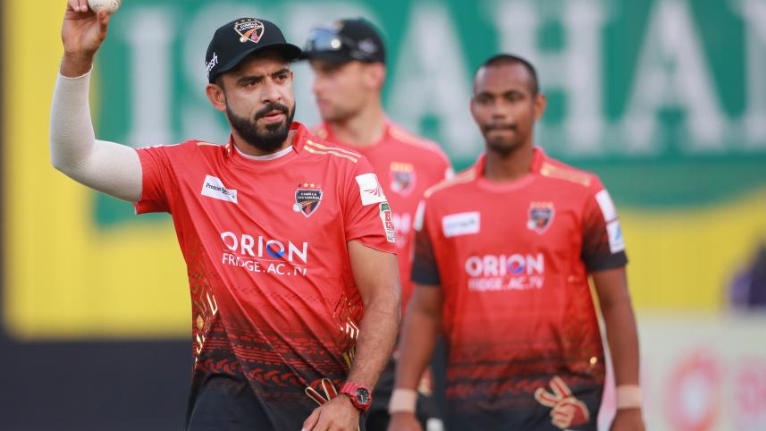 Comilla Victorians pacer Aamer Jamal celebrates his five-wicket haul against Khulna Tigers by raising the match ball. Photo: Firoz Ahmed 
