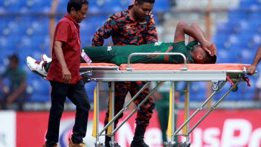 Mustafizur stretchered off the field