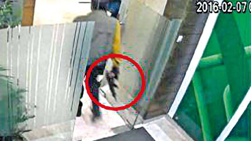 Tamal Parvez's gunman stands inside the boardroom with a firearm. 