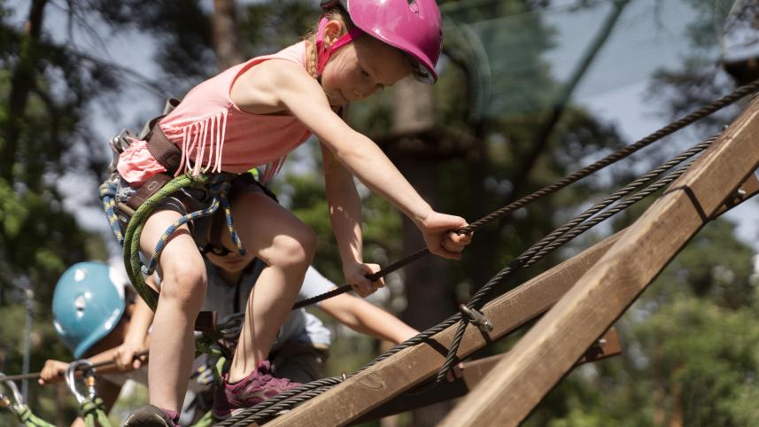 brave-girl-having-fun-adventure-park.jpg