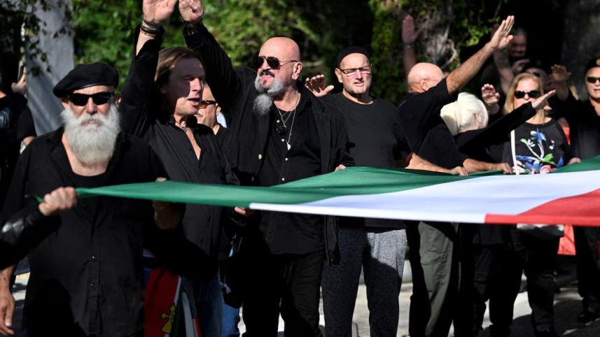 Neo-fascists do the Nazi salute as they gather in the town where dictator Benito Mussolini was born to commemorate the hundredth anniversary of the March on Rome, in Predappio, Italy, October 30, 2022. REUTERS/Flavio Lo Scalzo/File Photo Purchase Licensin