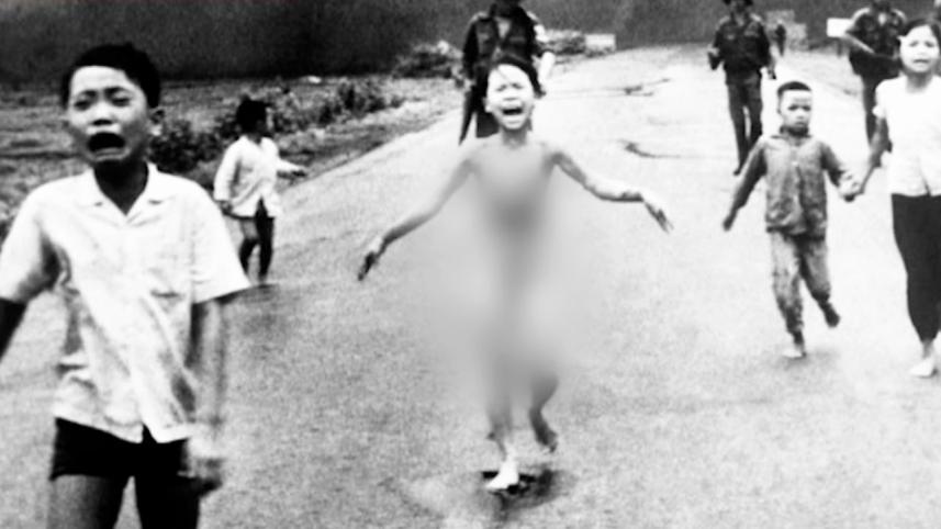 Girl screaming and running in pain after being attacked by napalm