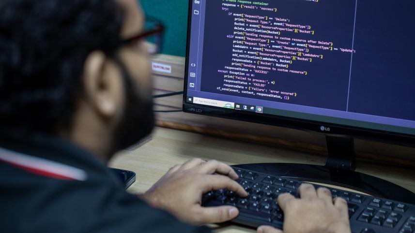 Person programming on a computer. 