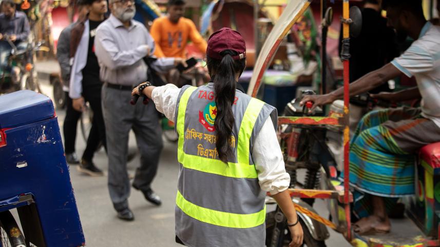A student managing traffic on the street