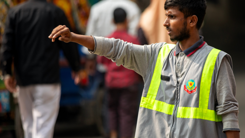 A student managing traffic on the street