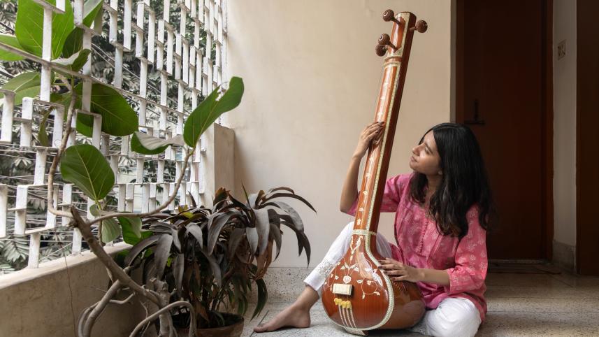 Musician playing the Sitar.