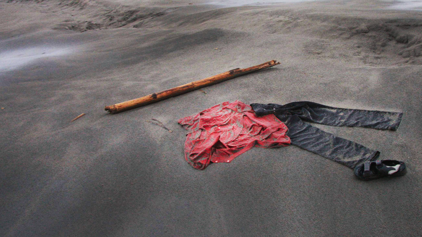 on_july_17_2011_six_students_were_beaten_to_death_by_a_mob_at_this_spot_in_keblarchar_in_amin_bazar._one_of_their_dresses_and_a_bamboo_used_to_kill_them_are_seen_in_this_photo.jpg