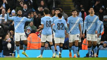 Manchester City's Ghanaian midfielder #42 Antoine Semenyo (L) celebrates scoring the team's sixth goal during the English FA Cup third round football match between Manchester City and Exeter City at the Etihad Stadium in Manchester, north west England, on January 10, 2026.