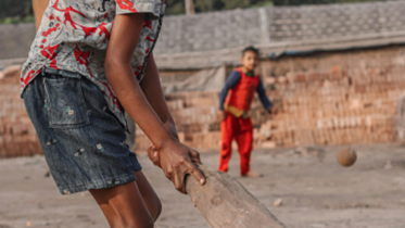 Children playing cricket.png