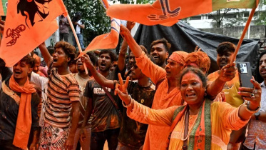 Bharatiya Janata Party (BJP) supporters celebrate after taking a lead during vote counting for the West Bengal Legislative Assembly elections, near the party head office in Kolkata on May 4, 2026. Photo: AFP