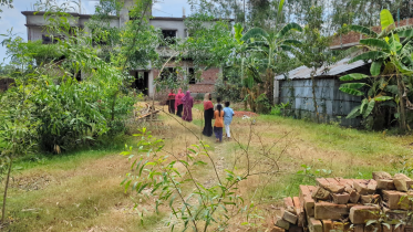 People gather in front of the family’s house as shock grips the area, leaving a heavy silence over the community after the news broke. Photo: Star