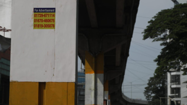 Stickers calling for advertisements are now seen on the pillars of the elevated expressway in Chattogram. Photo: Star