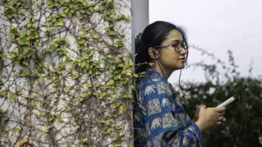 Young person listening to music