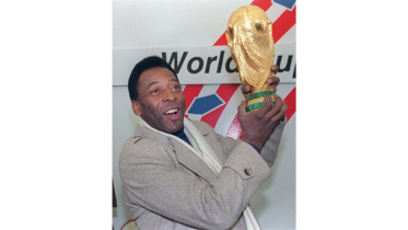Pele with World Cup trophy.jpg