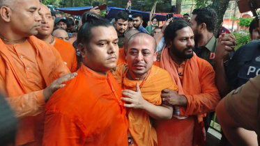 Chinmoy Krishno Das attending his mother's funeral.jpg