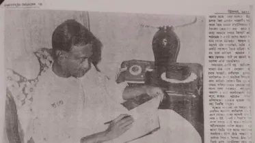 Ziaur Rahman writing his diary.jpg