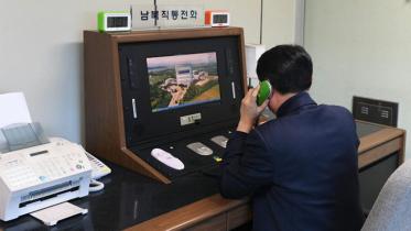 A South Korean government official checks the direct communications hotline