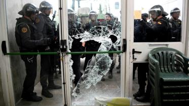 Spain's Guardia Civil broke through the door of a polling station in Sarria de Ter in Girona where the Catalan president was due to vote 
