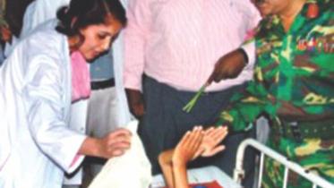 Dr. Tahmina Banu attending to a young patient at CMCH. 