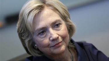 Hillary Clinton apologizes for using a personal email account run on a private server to conduct government business as secretary of state.