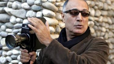 Abbas Kiarostami with a camera.