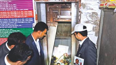 People gather around a collapsed lift