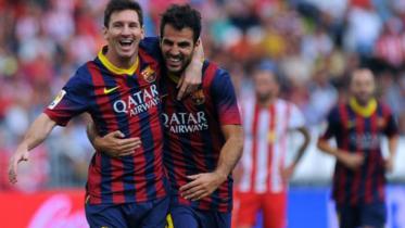 Lionel Messi and Cesc Fabregas
